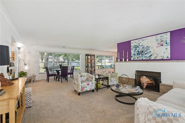 3468 Hughes Blvd, Toledo, OH 43606 - living area with carpet, a fireplace, and ornamental molding