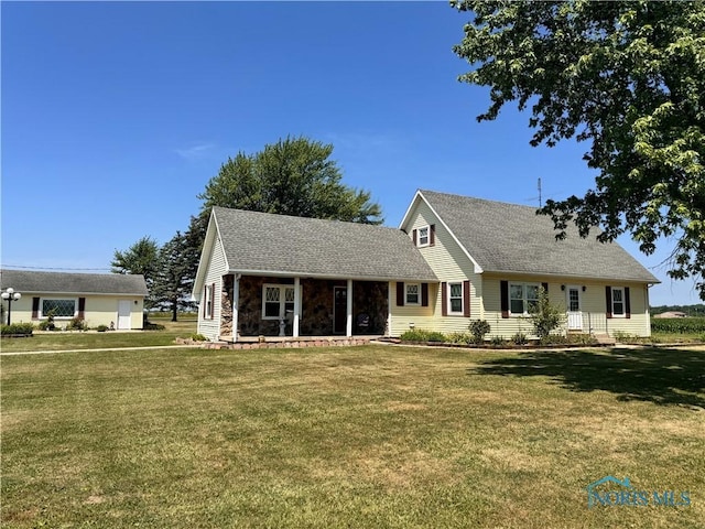 8320 Openlander Rd, Sherwood, OH 43556 - new england style home with a front lawn, a shingled roof, and stone siding