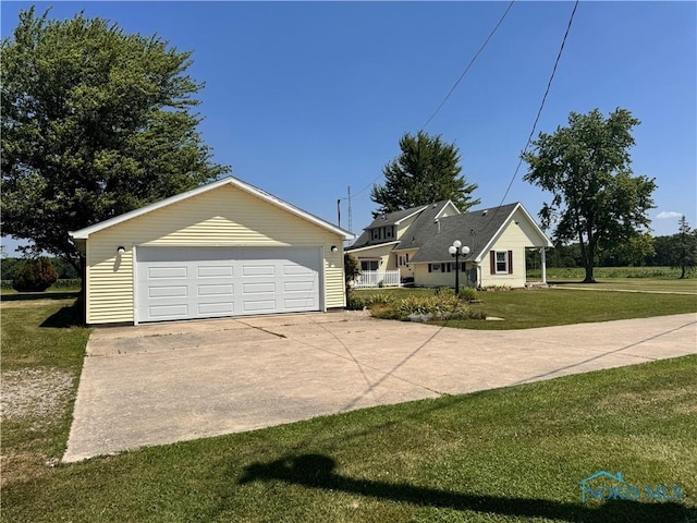 8320 Openlander Rd, Sherwood, OH 43556 - view of front of home with a garage, a front lawn, and an outdoor structure