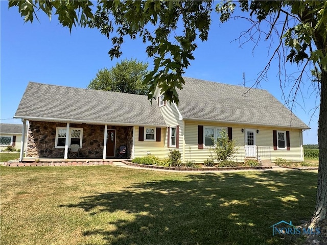 8320 Openlander Rd, Sherwood, OH 43556 - view of front facade with a front lawn, a shingled roof, and stone siding