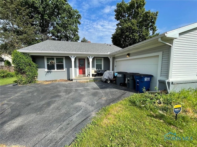 2158 Laurel Valley Dr, Toledo, OH 43614 - ranch-style home featuring asphalt driveway and an attached garage