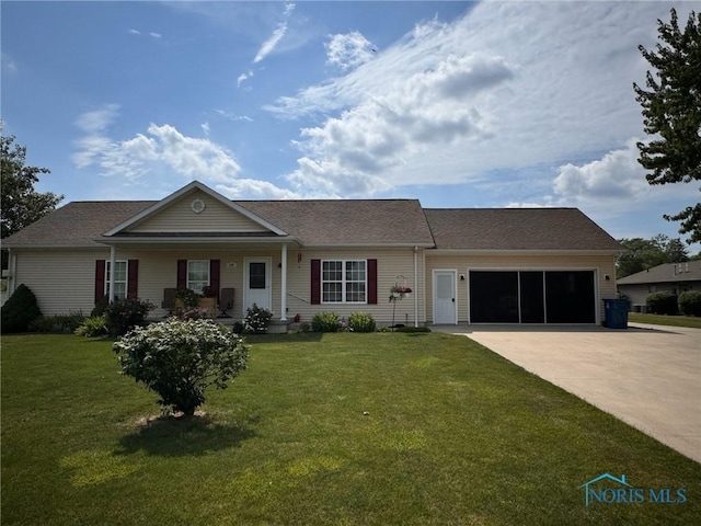 110 Town Line Rd, Bryan, OH 43506 - ranch-style home featuring driveway, an attached garage, a front lawn, and a porch