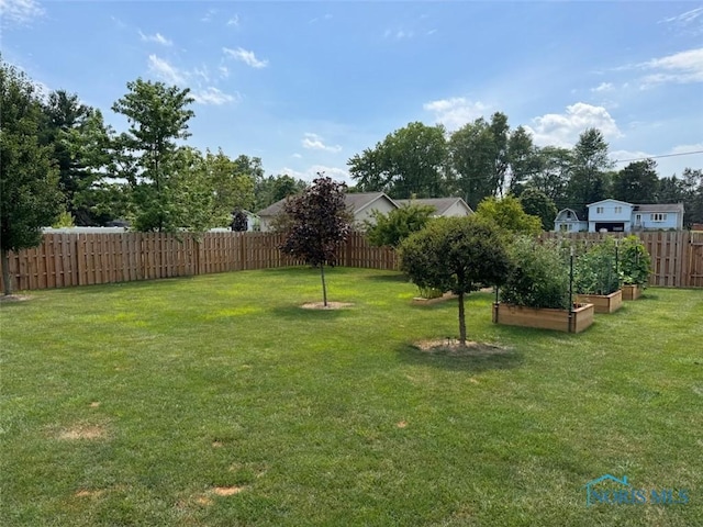 110 Town Line Rd, Bryan, OH 43506 - fenced backyard featuring a vegetable garden