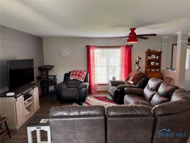 110 Town Line Rd, Bryan, OH 43506 - living area featuring dark wood-style floors, ceiling fan, and wooden walls