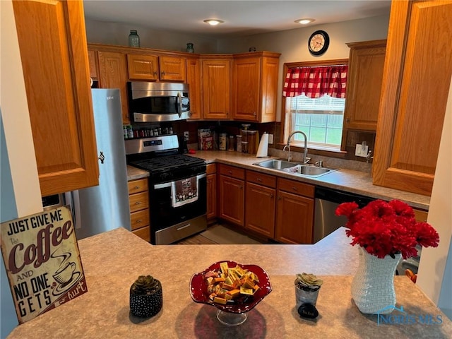 110 Town Line Rd, Bryan, OH 43506 - kitchen with stainless steel appliances, light countertops, and brown cabinetry