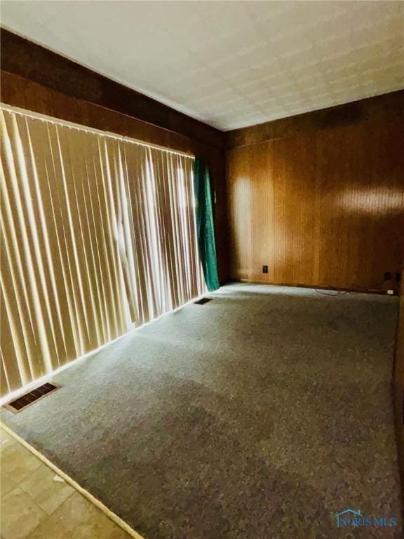 4136 Berwick Ave, Toledo, OH 43612 - unfurnished room featuring wood walls