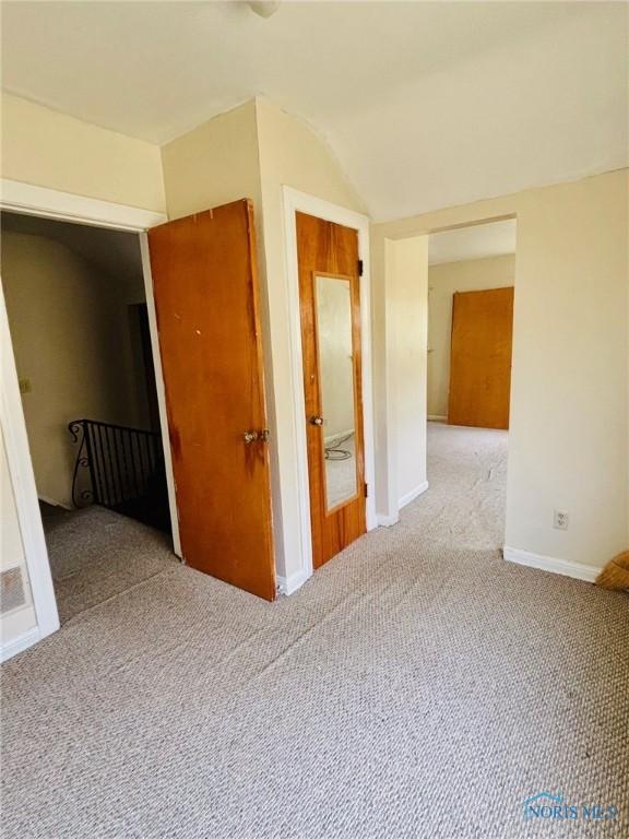 4136 Berwick Ave, Toledo, OH 43612 - unfurnished room with carpet and vaulted ceiling