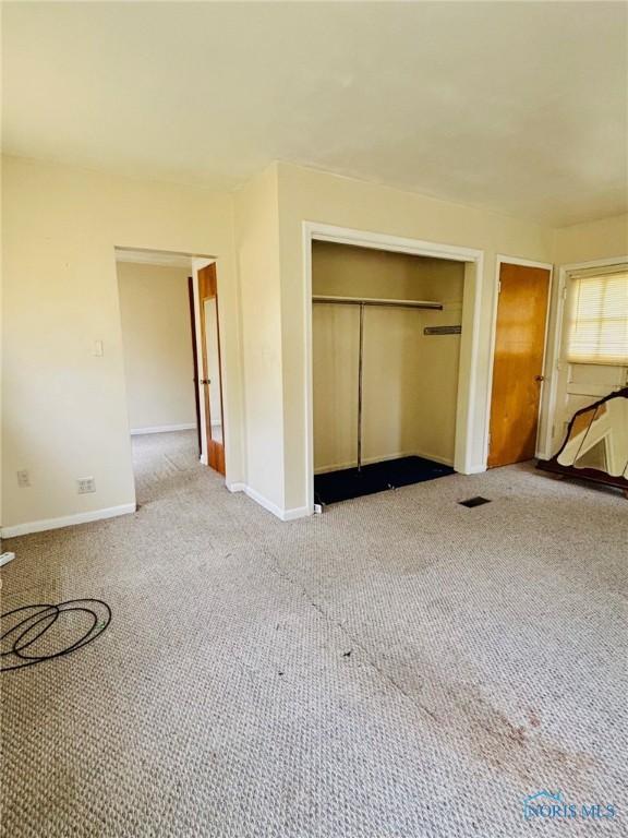 4136 Berwick Ave, Toledo, OH 43612 - unfurnished bedroom featuring a closet and carpet flooring