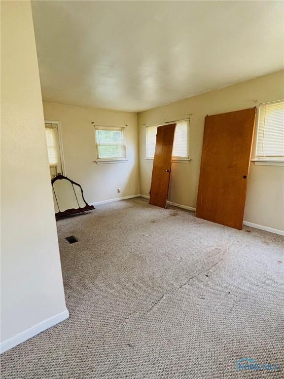 4136 Berwick Ave, Toledo, OH 43612 - unfurnished living room with carpet flooring