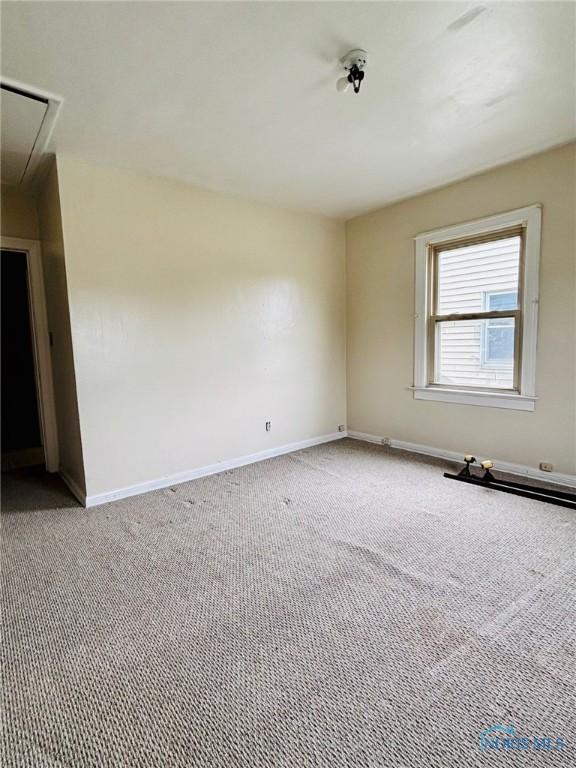 4136 Berwick Ave, Toledo, OH 43612 - spare room featuring attic access and carpet flooring