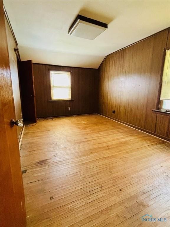 4136 Berwick Ave, Toledo, OH 43612 - empty room featuring light wood-type flooring and wooden walls