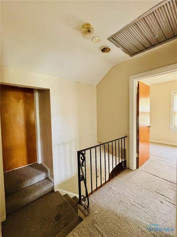 4136 Berwick Ave, Toledo, OH 43612 - stairs featuring carpet flooring and lofted ceiling