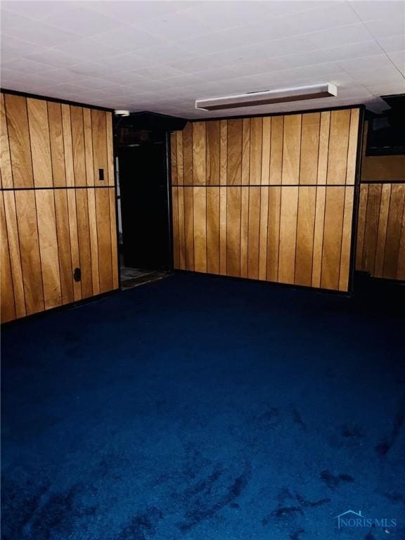 4136 Berwick Ave, Toledo, OH 43612 - finished basement with wood walls and dark carpet