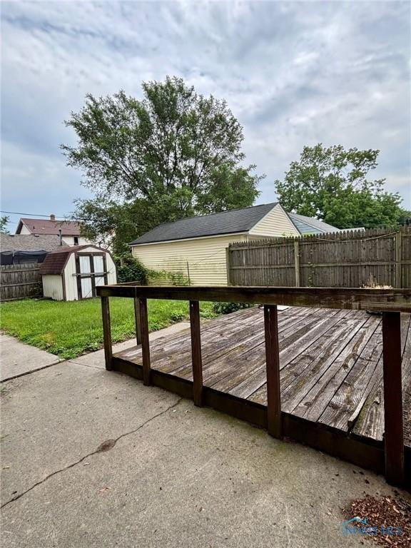 4136 Berwick Ave, Toledo, OH 43612 - gate featuring a shed, a fenced backyard, and a deck