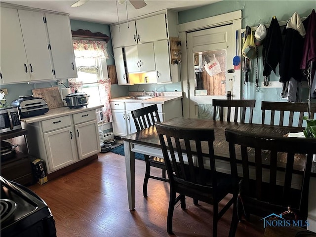 11080 Rd 21, Antwerp, OH 45813 - kitchen with light countertops, dark wood finished floors, stainless steel microwave, and electric range