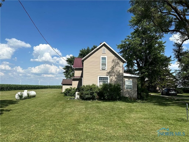 11080 Rd 21, Antwerp, OH 45813 - view of side of home with a yard and a metal roof