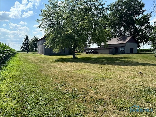 11080 Rd 21, Antwerp, OH 45813 - view of grassy yard with an outbuilding and a pole building