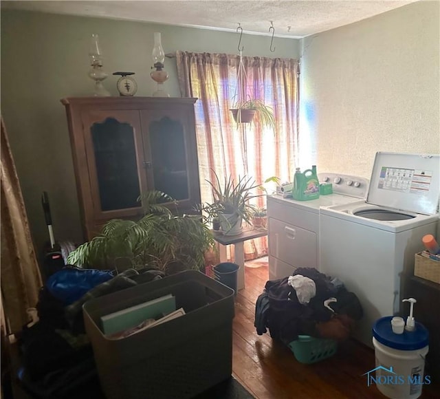 11080 Rd 21, Antwerp, OH 45813 - washroom with a textured ceiling, light wood-style flooring, and washer and dryer