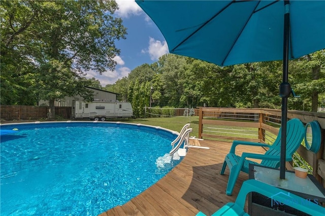8411 Larch Rd, Toledo, OH 43617 - view of swimming pool with a wooden deck