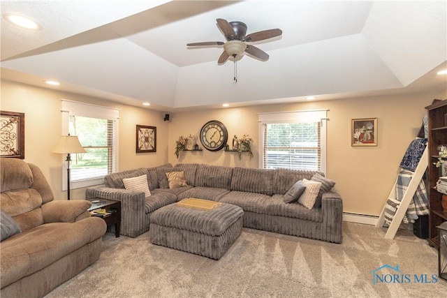 8411 Larch Rd, Toledo, OH 43617 - carpeted living room featuring a baseboard radiator, recessed lighting, a raised ceiling, and a ceiling fan