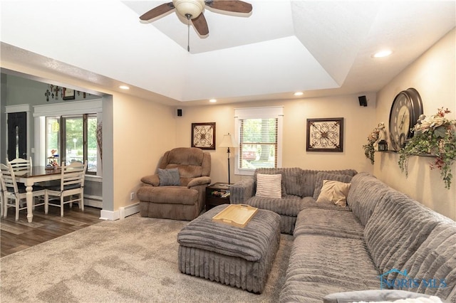 8411 Larch Rd, Toledo, OH 43617 - living area featuring a baseboard heating unit, recessed lighting, ceiling fan, and wood finished floors