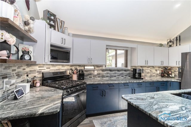 8411 Larch Rd, Toledo, OH 43617 - kitchen featuring stainless steel appliances, open shelves, light stone counters, and backsplash