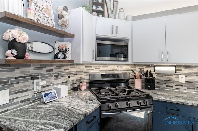 8411 Larch Rd, Toledo, OH 43617 - kitchen featuring stainless steel appliances, open shelves, backsplash, and blue cabinets