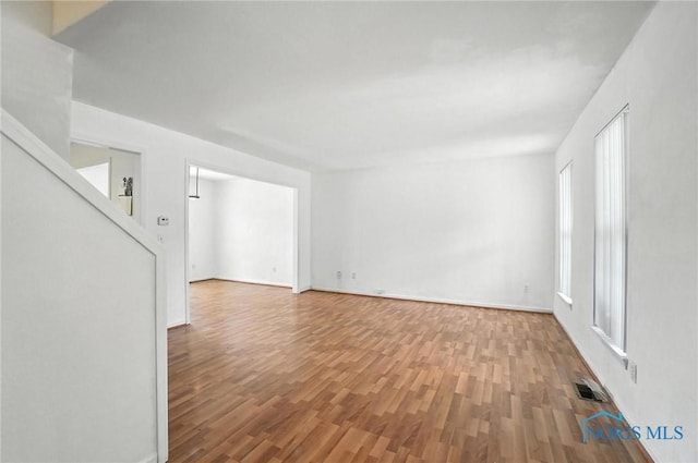1939 Macomber St, Toledo, OH 43606 - unfurnished room featuring wood finished floors and baseboards