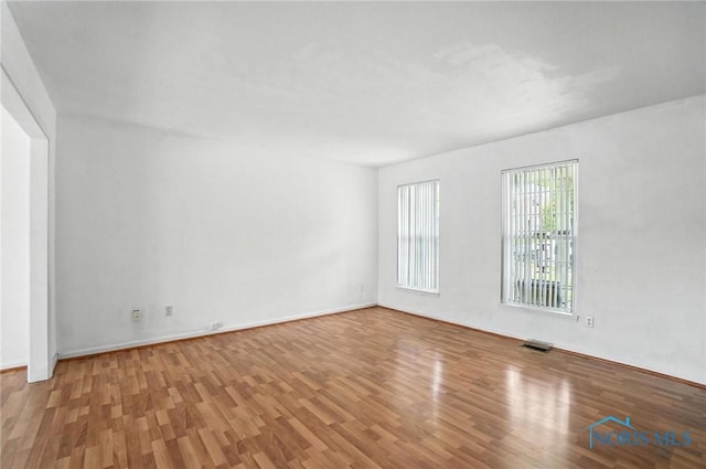 1939 Macomber St, Toledo, OH 43606 - spare room featuring wood finished floors and baseboards