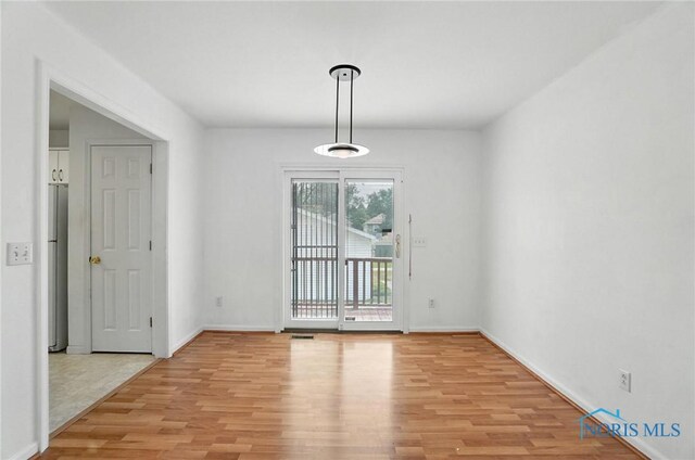 1939 Macomber St, Toledo, OH 43606 - unfurnished room with light wood-style floors and baseboards