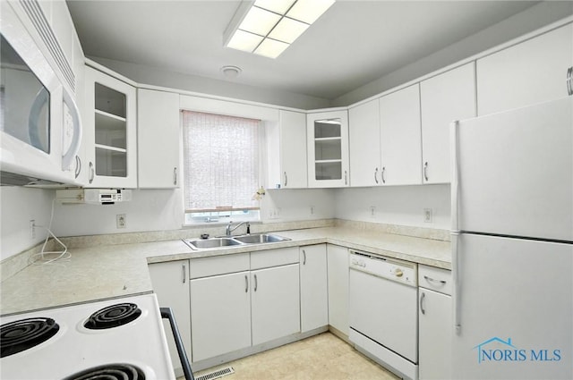 1939 Macomber St, Toledo, OH 43606 - kitchen featuring white appliances, light countertops, and white cabinets