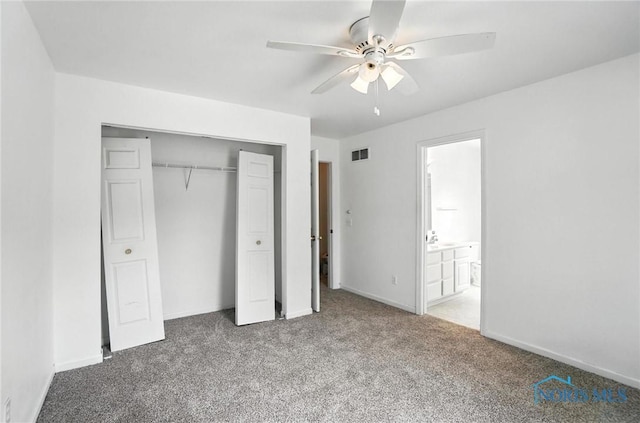 1939 Macomber St, Toledo, OH 43606 - unfurnished bedroom with carpet flooring, a closet, a ceiling fan, and ensuite bathroom