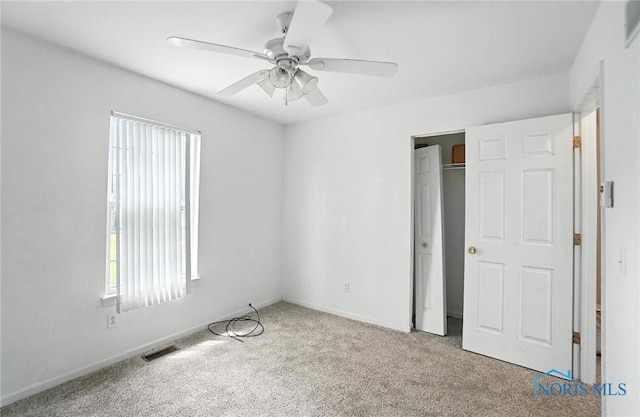 1939 Macomber St, Toledo, OH 43606 - unfurnished bedroom with carpet floors, a closet, and a ceiling fan