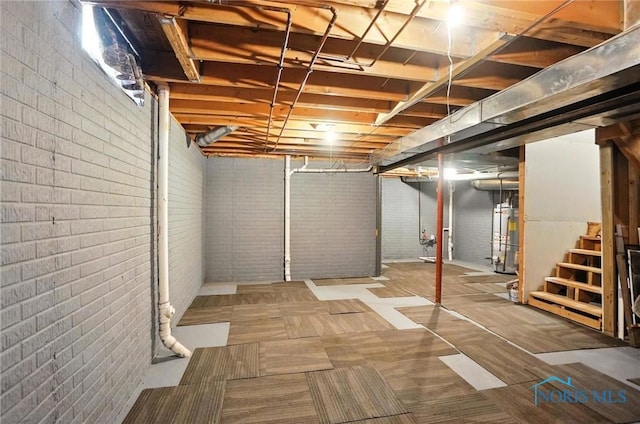1939 Macomber St, Toledo, OH 43606 - unfinished below grade area with gas water heater and stairway