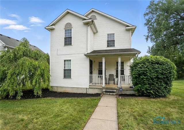 1939 Macomber St, Toledo, OH 43606 - view of front of property featuring covered porch and a front yard