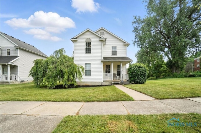 1939 Macomber St, Toledo, OH 43606 - traditional-style house with covered porch and a front yard