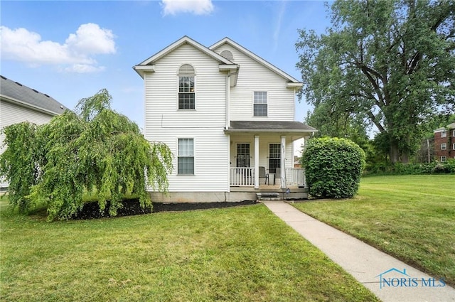1939 Macomber St, Toledo, OH 43606 - view of front of home featuring covered porch and a front lawn