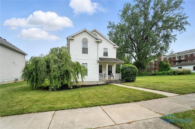 1939 Macomber St, Toledo, OH 43606 - view of front of property featuring a porch and a front lawn