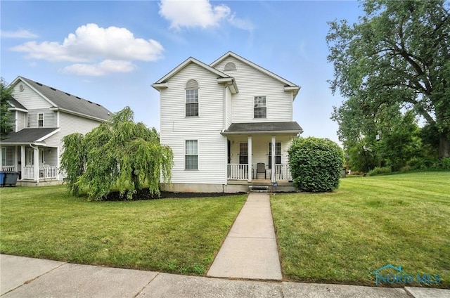 1939 Macomber St, Toledo, OH 43606 - view of front of property with covered porch and a front lawn