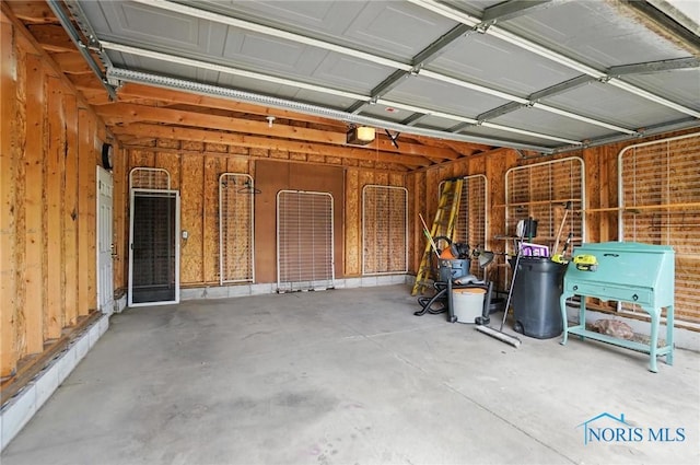 1939 Macomber St, Toledo, OH 43606 - garage featuring a garage door opener