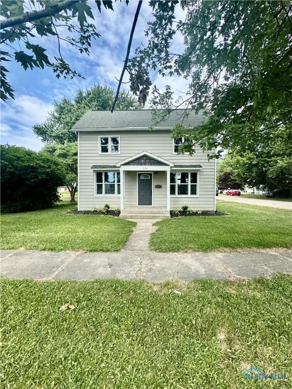 339 N E Ave, Deshler, OH 43516 - view of front facade with a front lawn