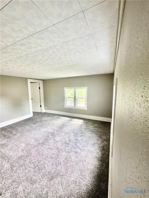 339 N E Ave, Deshler, OH 43516 - carpeted spare room with baseboards