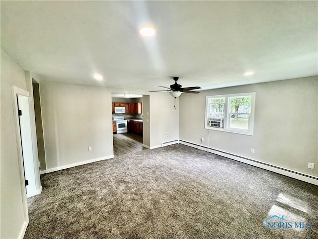 339 N E Ave, Deshler, OH 43516 - unfurnished living room with dark carpet, a ceiling fan, a baseboard heating unit, recessed lighting, and baseboard heating