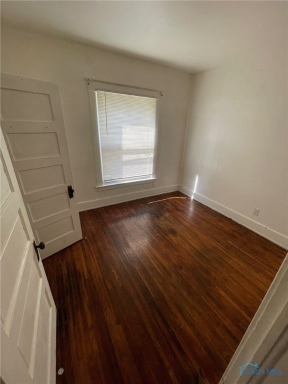 421 Oswald St, Toledo, OH 43605 - spare room with dark wood finished floors and baseboards