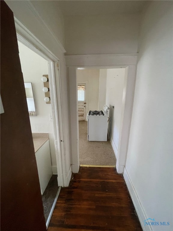 421 Oswald St, Toledo, OH 43605 - corridor with dark wood-style floors and baseboards
