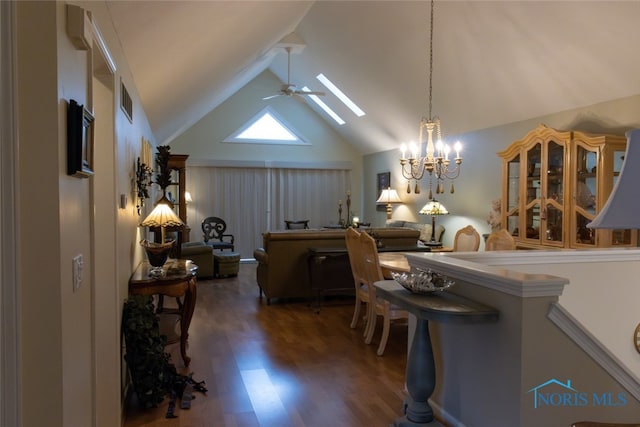 1533 Eaglebrook Rd Unit 1533, Toledo, OH 43615 - dining area featuring wood finished floors, a ceiling fan, vaulted ceiling, a skylight, and a chandelier