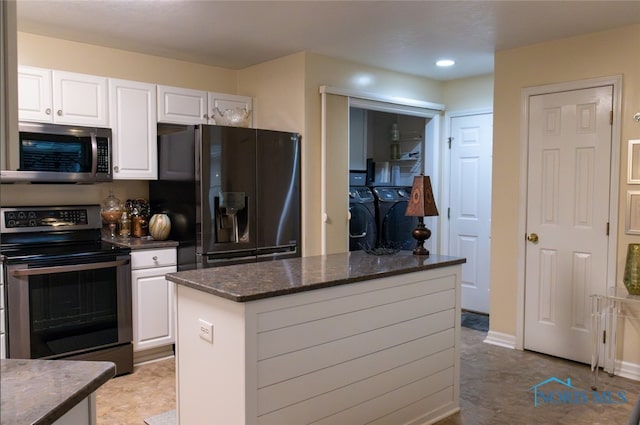 1533 Eaglebrook Rd Unit 1533, Toledo, OH 43615 - kitchen with stainless steel appliances, washer and dryer, white cabinetry, a kitchen island, and recessed lighting