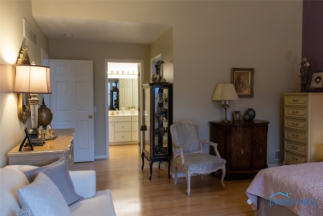 1533 Eaglebrook Rd Unit 1533, Toledo, OH 43615 - bedroom featuring light wood-type flooring and ensuite bathroom