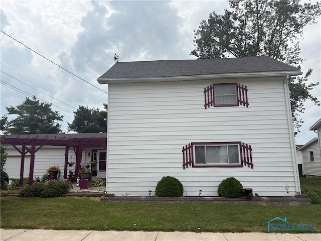 9097 Custar Rd, Custar, OH 43511 - view of side of property with a pergola and a lawn