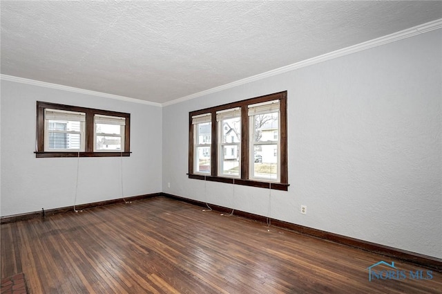 2517 Montebello Rd, Toledo, OH 43607 - empty room featuring dark wood-style flooring, ornamental molding, and a textured ceiling